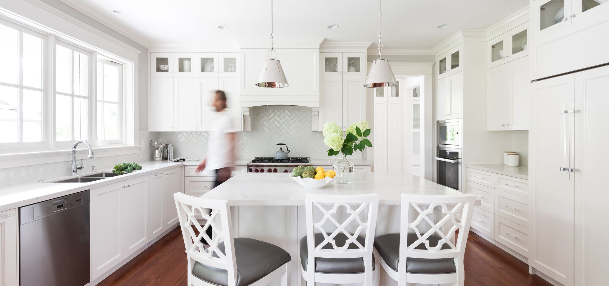 All white kitchen with a center aisle