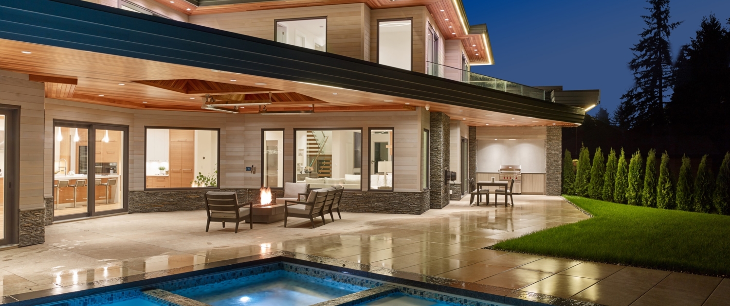 Outdoor living room with a fire pit, grill, and a swimming pool