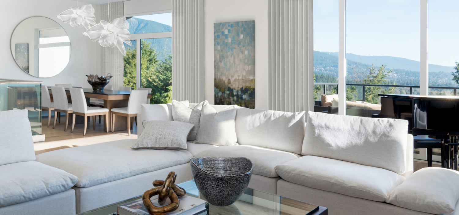 sentinel1 White couch in a white living room with a piano
